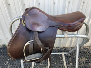 Maroon color, Borelli all purpose saddle: 17 inches, with stirrups. ($100)